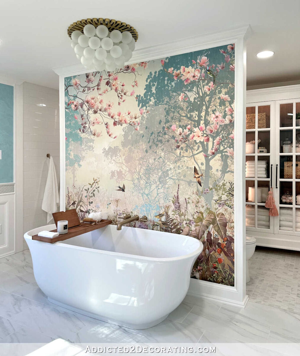 Mural wallpaper feature in an elegant bathroom