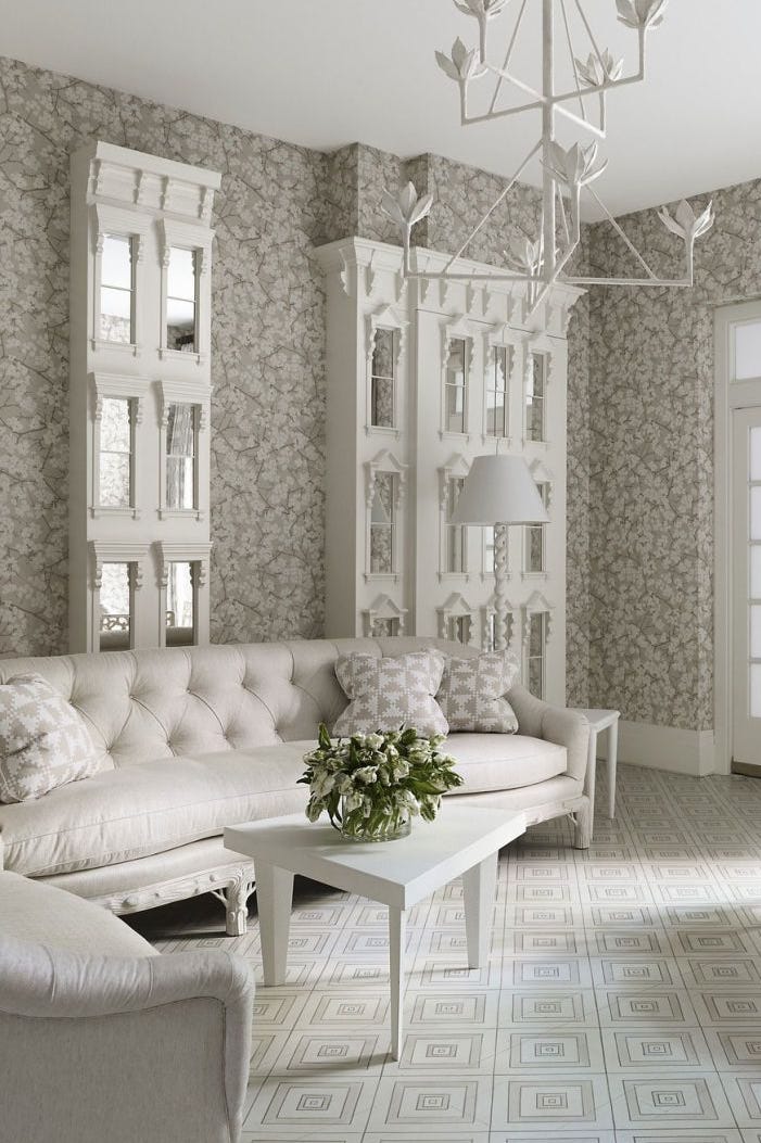 Patterned wallpaper in a bright editorial living room