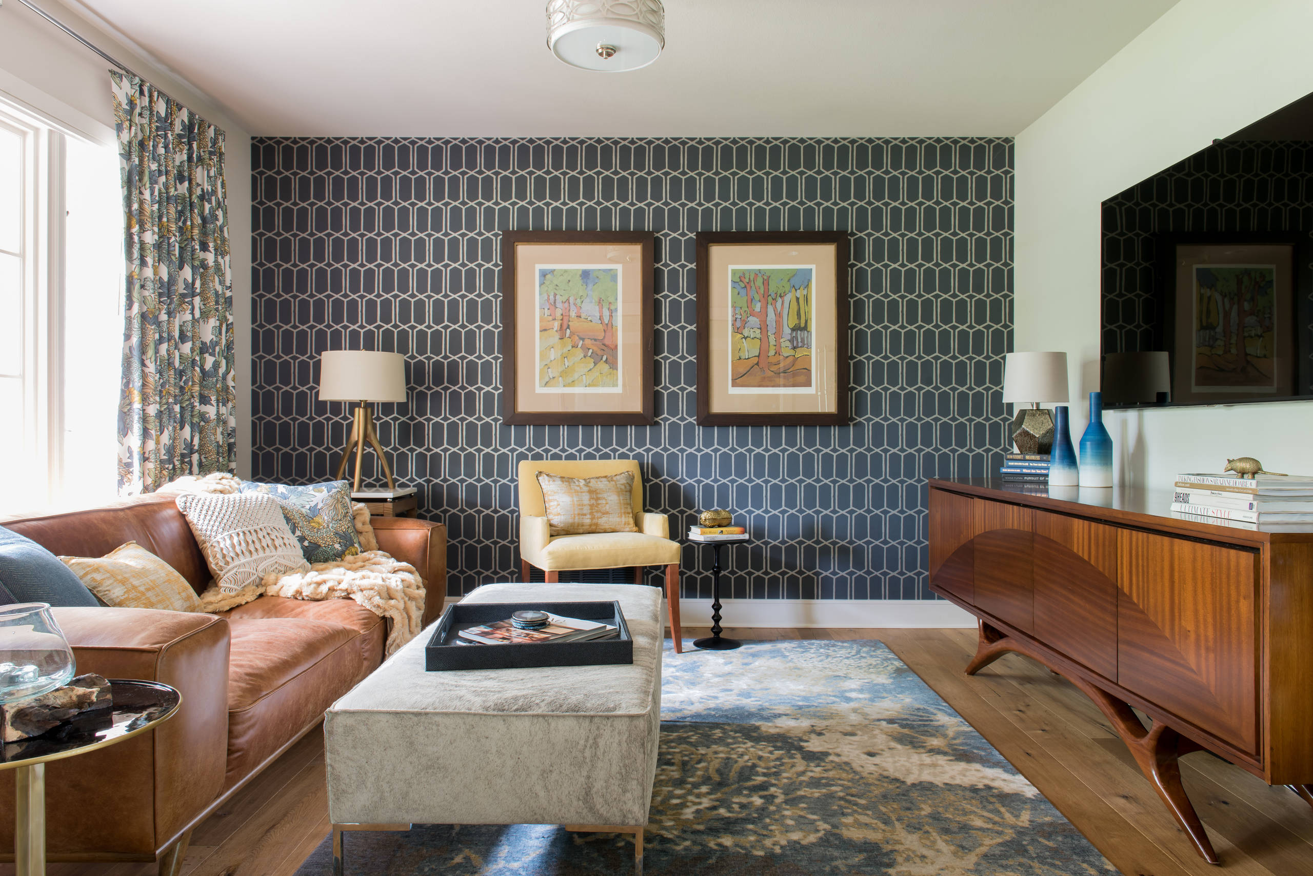 Elegant wallpapered living room with patterned wallcovering